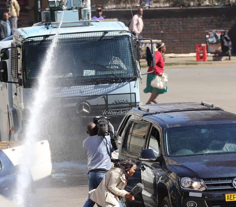 Zim MDC Demo: Car burnt, Aljazeera reporter attacked & Police brutality.. Harare Pictures