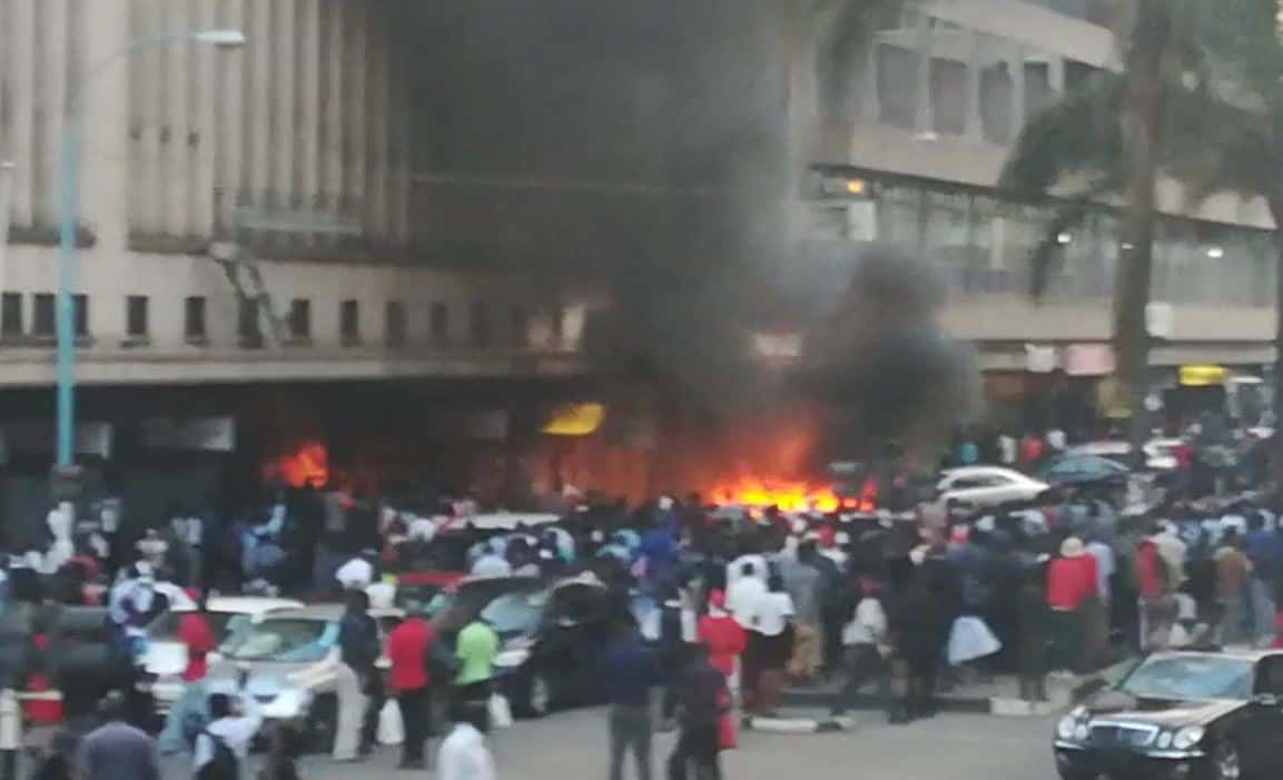 BREAKING Pictures: Fire in Harare CBD, Car gutted, Power Sales shop damaged..VIDEO