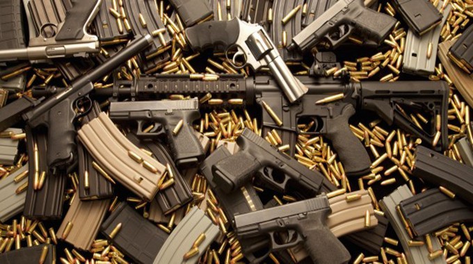 Army colonel accused of smuggling guns weeps in court, faces long jail sentence