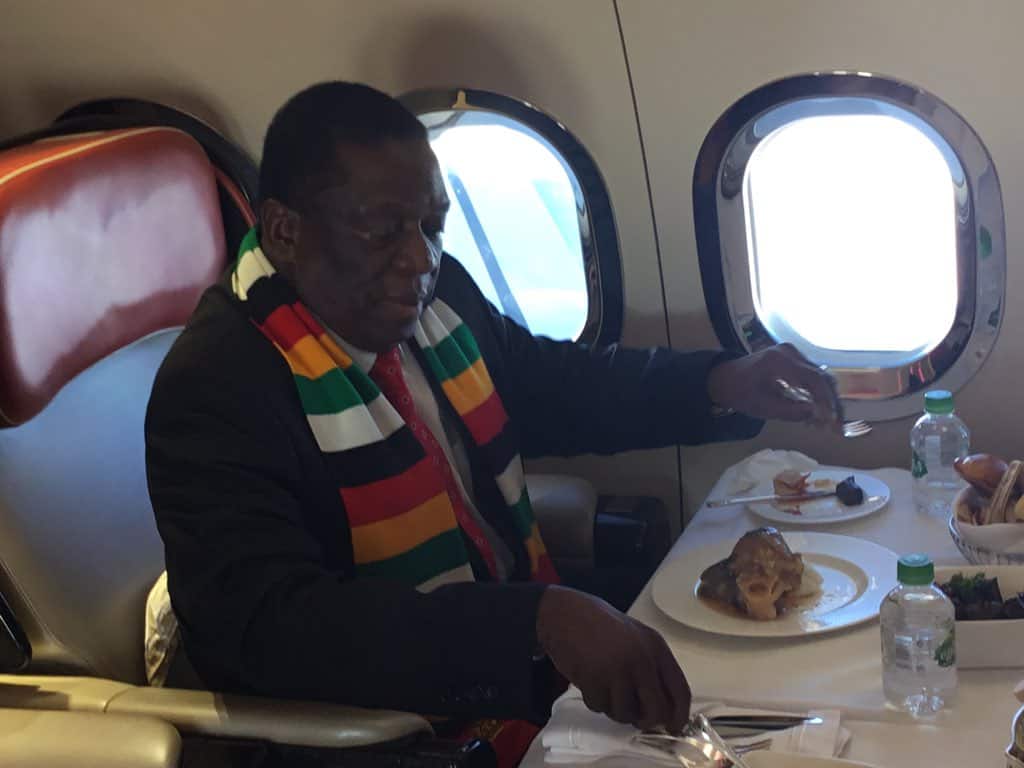 PICTURES:President Mnangagwa eating mazondo in plane