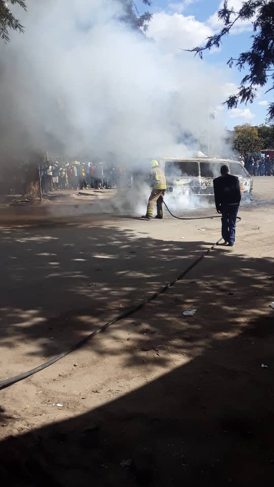 …PICTURES-VIDEO…2 combis burnt to ashes after police officers threw tear gas canisters inside