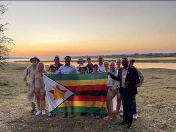 American business executives on Africa tour date Victoria Falls