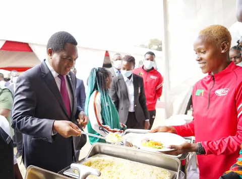 I’m here to serve you, Zambian President Hichilema dishes food… PICTURES…