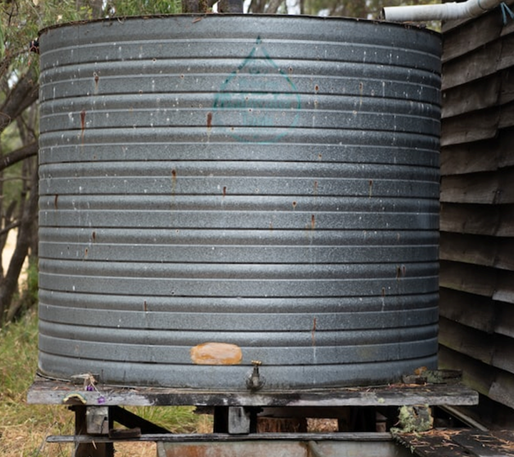 What are the uses of a 5000-litre water storage tank?