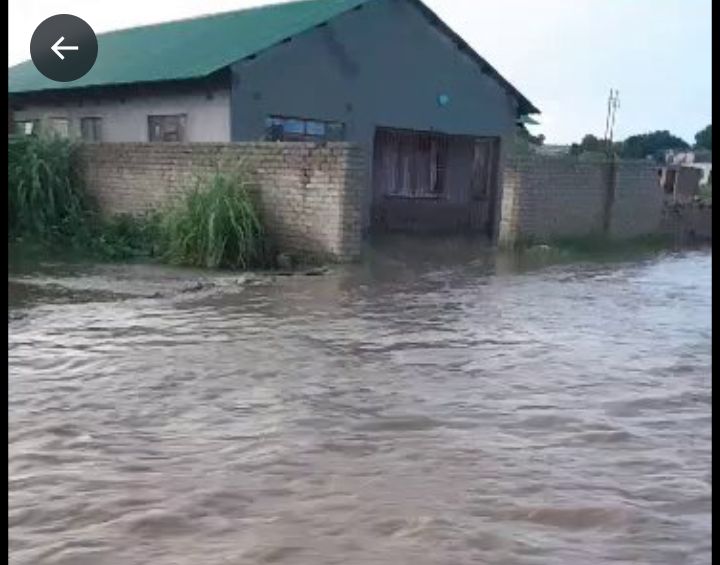 Houses swept by floods in Harare