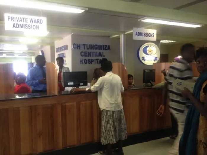 Patients at Chitungwiza Central Hospital use cellphones at torches to navigate corridors