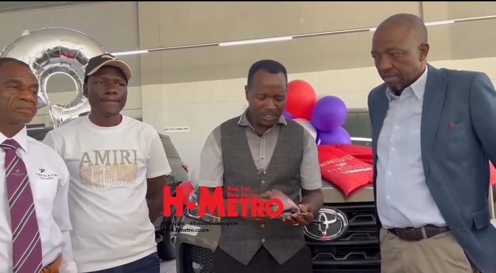 Leonard Zhakata collects his Toyota Fortuner from Chivayo